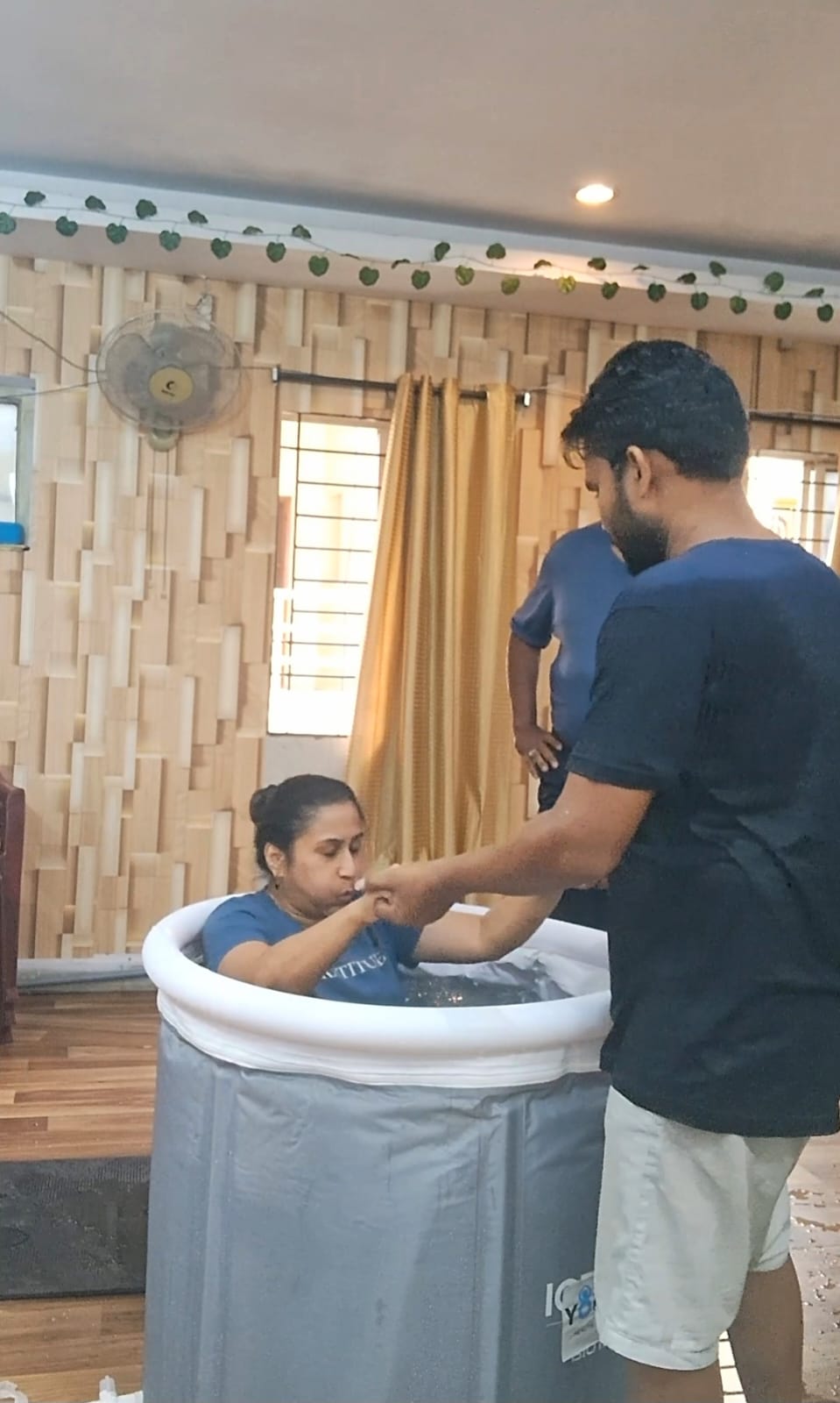 Dr. Vinayana Jain in the ice bath with a trainer supporting her at the Yoganta Ice Bath Instructor Course (YCIBI) workshop in Hyderabad.