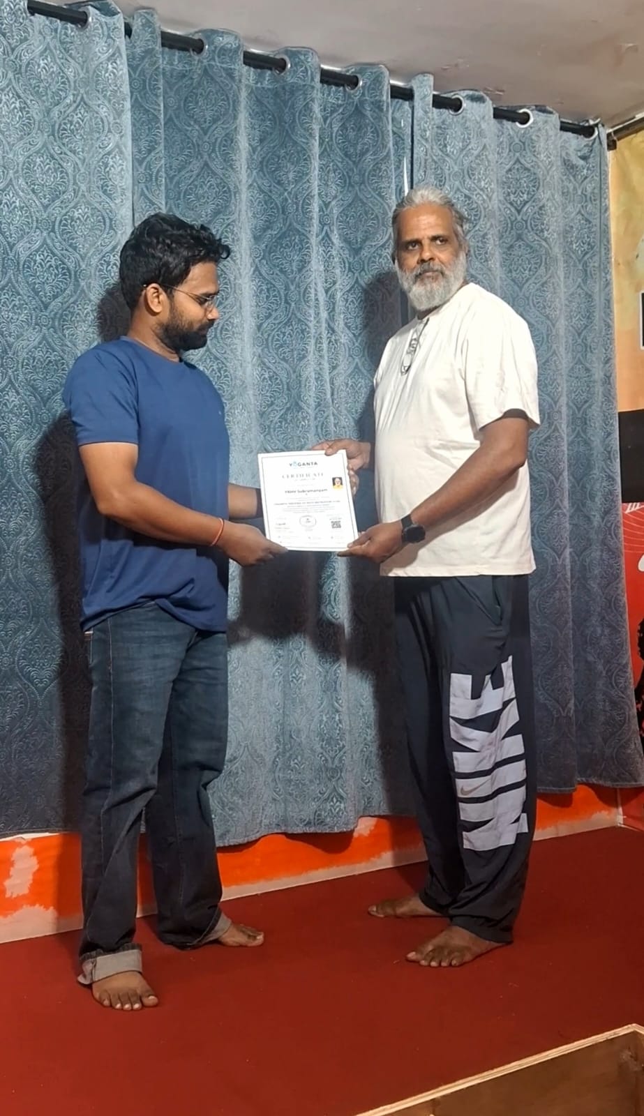 Hari Subramanyam receiving his Yoganta Ice Bath Instructor Course (YCIBI) certificate from Raushan Yoganta at the workshop in Hyderabad.