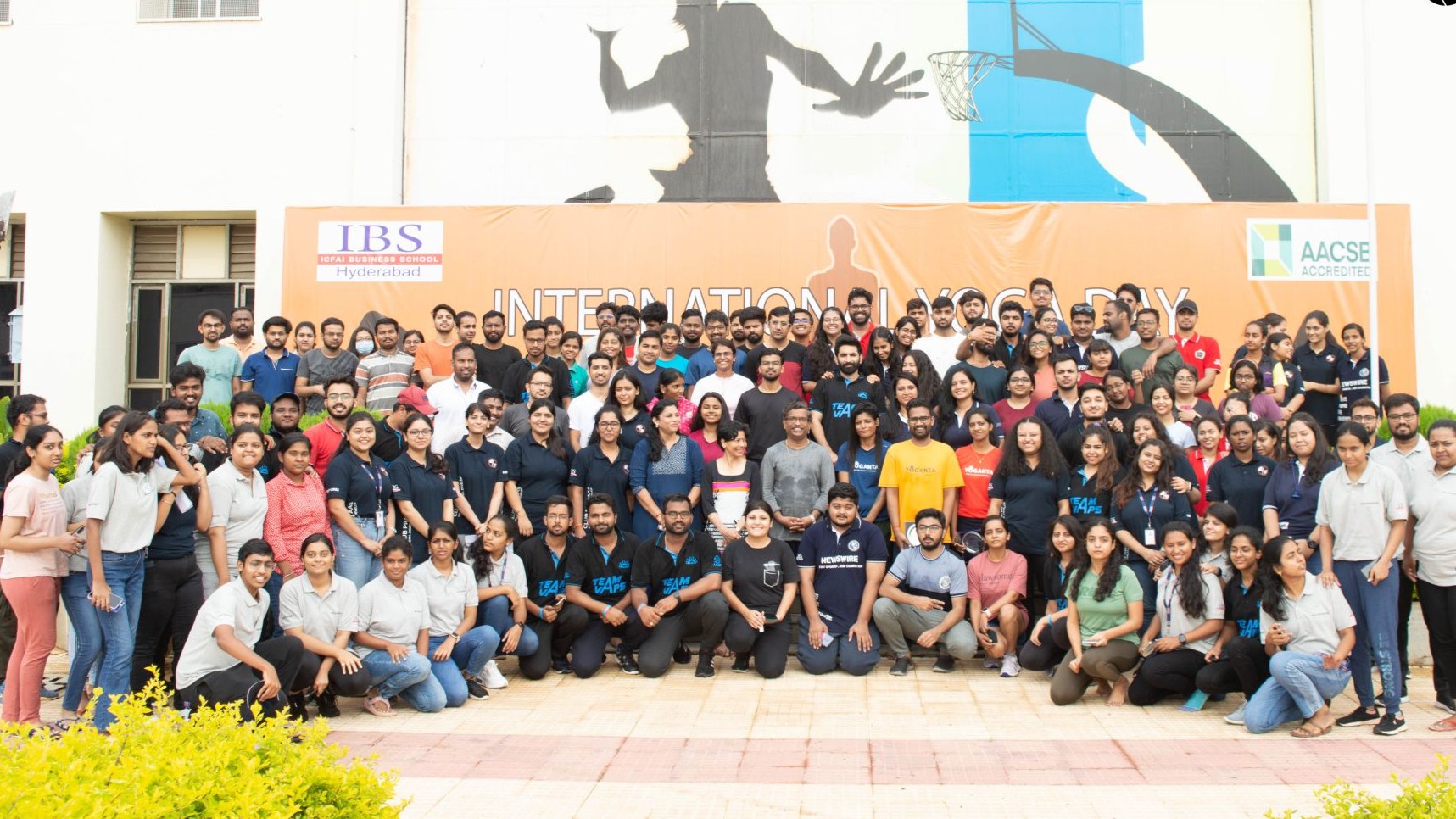 Group photograph of participants and organizers at the Yoganta wellness event hosted at IBS Hyderabad in 2023.