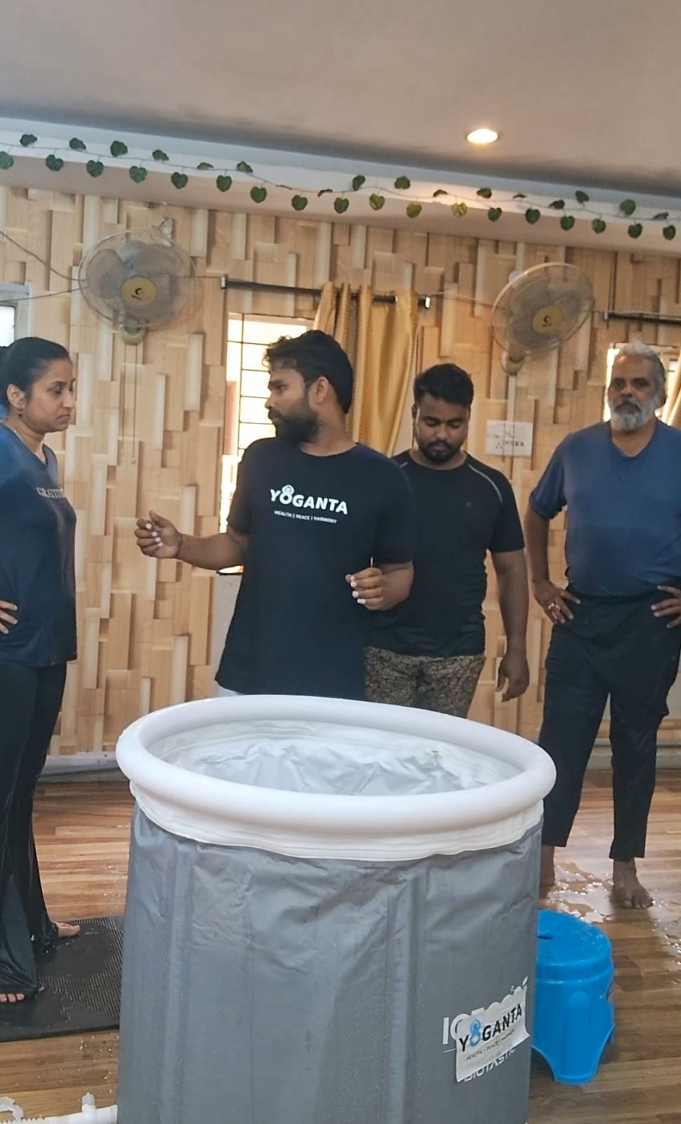 Raushan Yoganta guiding ice bath trainers beside a Yoganta ice bath tub at the Yoganta Ice Bath Instructor Course (YCIBI) workshop in Hyderabad.