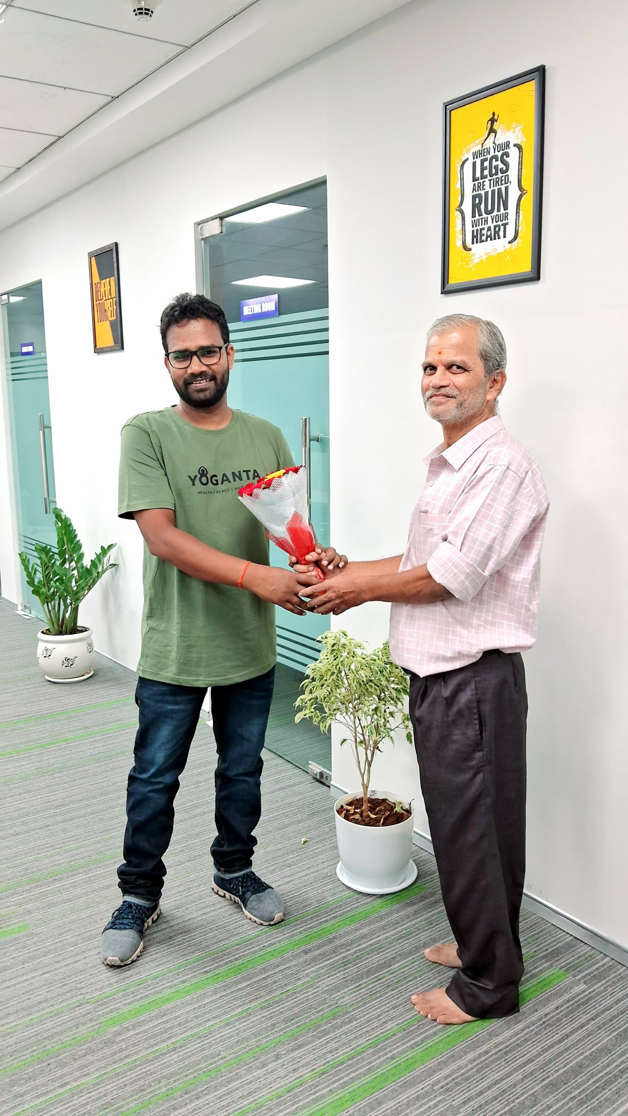 Raushan Yoganta receiving recognition from SIA Publishers for his contribution to yoga and wellness.